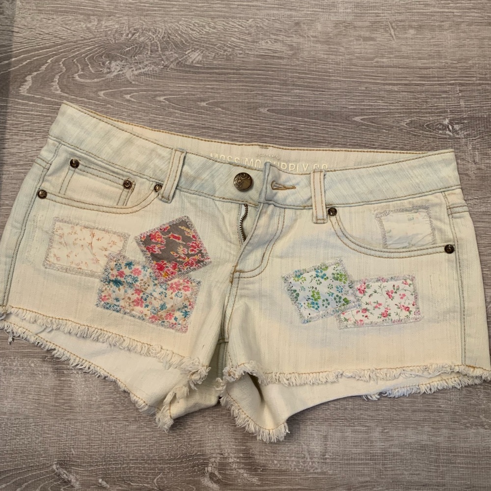 Patched jean shorts